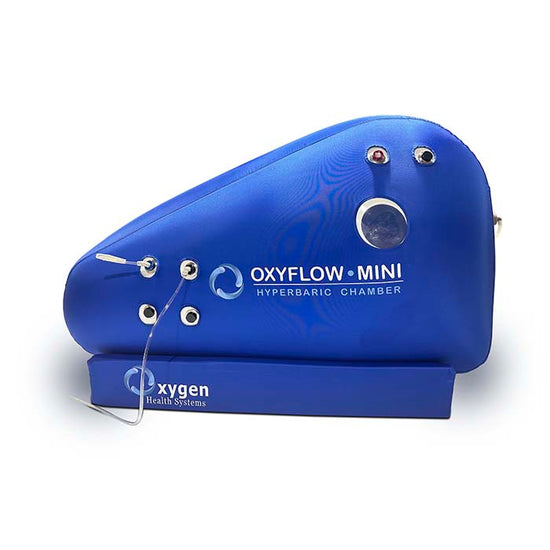 OXYFLOW MINI hyperbaric chamber in blue, showcasing design and pressure valves for oxygen therapy.
