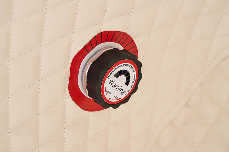 Back view of a hyperbaric oxygen chamber with connections and control panel displayed.